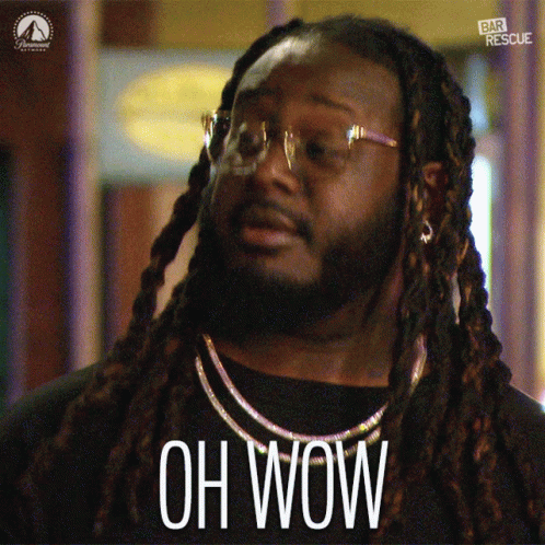 A Man With Long Dreadlocks And Glasses Says " Oh Wow " GIF