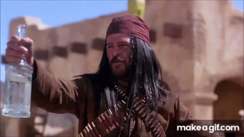 A Man With Long Hair And A Bandana Is Holding A Bottle Of Alcohol . GIF