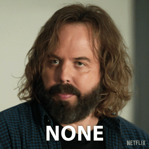 A Man With Long Hair And A Beard Has The Word None Above His Face GIF