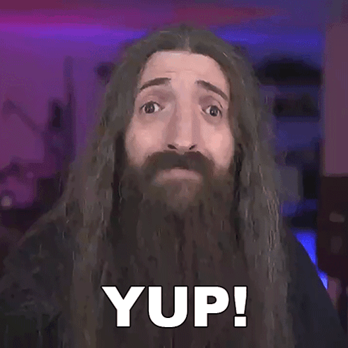 A Man With Long Hair And A Beard Has The Word Yup On His Face GIF