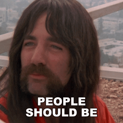 A Man With Long Hair And A Beard Has The Words People Should Be Written On His Face GIF