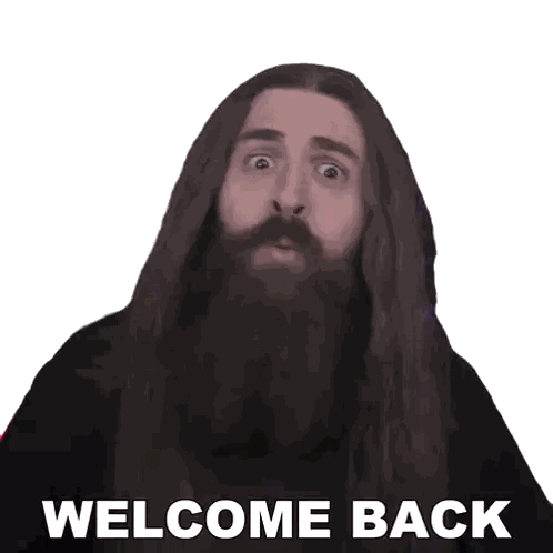 a man with long hair and a beard has the words welcome back on his face