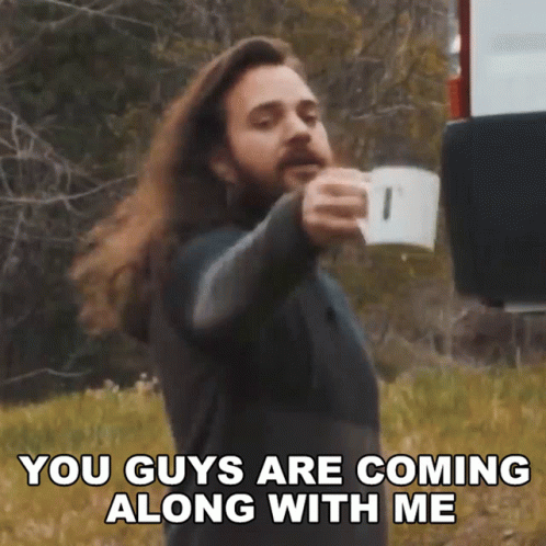 A Man With Long Hair And A Beard Is Holding A Cup Of Coffee And Saying You Guys Are Coming Along With Me GIF