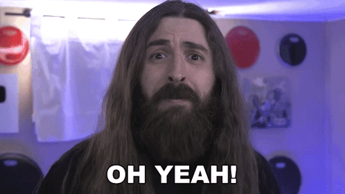 A Man With Long Hair And A Beard Is Making A Funny Face And Saying `` Oh Yeah '' . GIF