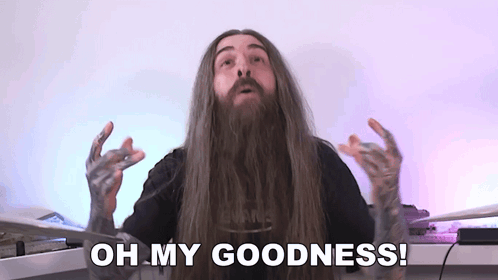 A Man With Long Hair And A Beard Is Making A Funny Face And Says `` Oh My Goodness '' . GIF