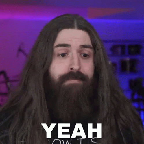 Man With Long Hair And Beard Making Funny Face GIF