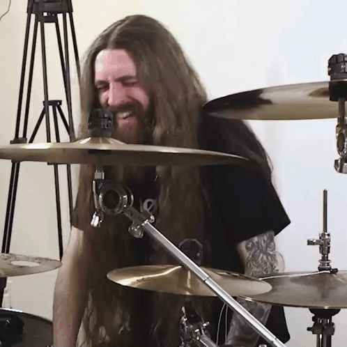 Man With Long Hair And Beard Playing Drums GIF