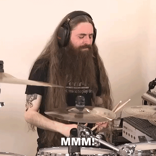 Man With Long Hair And Beard Playing Drums GIF