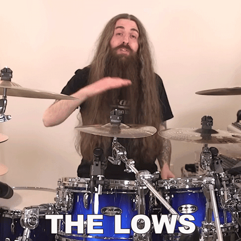 Man With Long Hair And Beard Playing Drums GIF