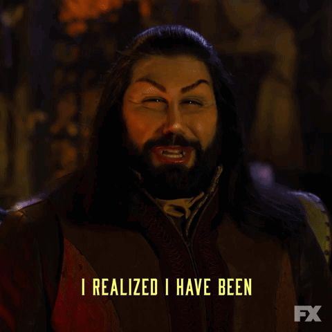 A Man With Long Hair And A Beard Is Saying " Completely Ruining My Life " GIF