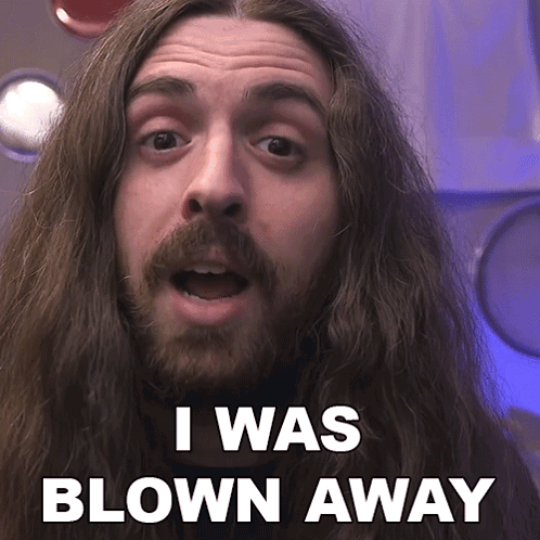 A Man With Long Hair And A Beard Is Saying " I Was Blown Away " GIF