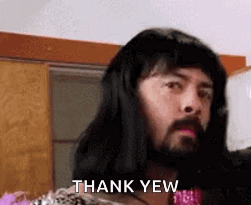 A Man With Long Hair And A Beard Is Saying Thank Yew . GIF
