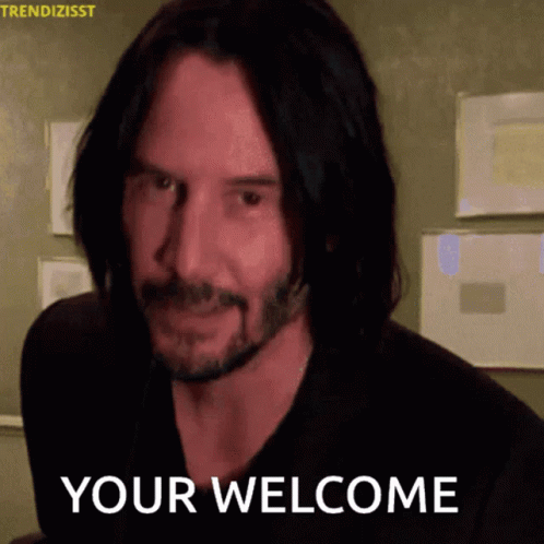 A Man With Long Hair And A Beard Is Smiling And Says " Your Welcome " GIF