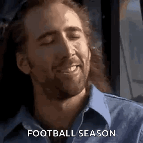 A Man With Long Hair And A Beard Is Smiling With His Eyes Closed And The Words `` Football Season '' Written Below Him . GIF