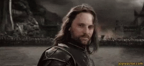 A Man With Long Hair And A Beard Is Standing In Front Of A Crowd And Says , `` Yolo '' . GIF
