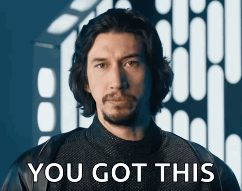 A Man With Long Hair And A Beard Is Standing In Front Of A Sign That Says " You Got This " GIF