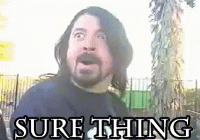 A Man With Long Hair And A Beard Is Standing In Front Of A Tree With The Words `` Sure Thing '' Written Above Him . GIF