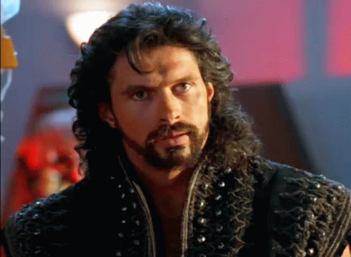 Man With Long Hair And Beard In Leather Vest GIF