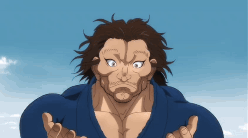 A Man With Long Hair And A Beard Is Wearing A Blue Shirt And Has His Hands Outstretched GIF