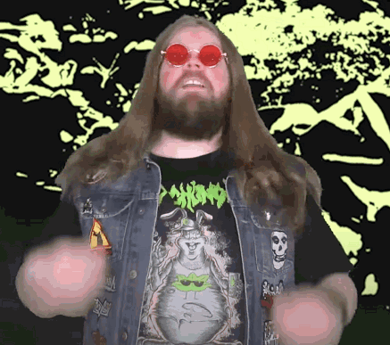 A Man With Long Hair And A Beard Is Wearing A Shirt That Says Psycho On It GIF