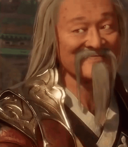 A Man With Long Hair And A Beard Is Wearing Armor And A Sword . GIF