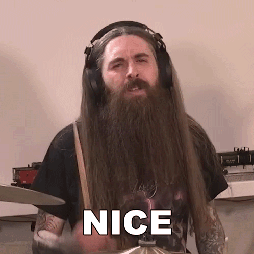 Man With Long Hair And Beard Playing Drums Saying Nice GIF