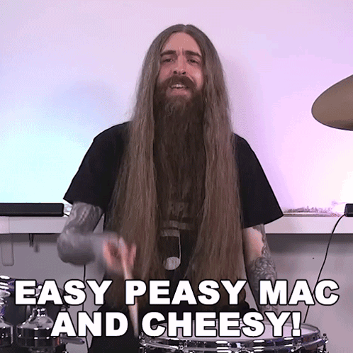 A Man With Long Hair And A Beard Playing Drums With The Words Easy Peasy Mac And Cheesy Below Him GIF