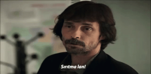 A Man With Long Hair And A Beard Says " Sirtma Lan " GIF