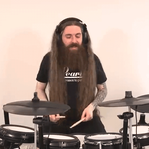 Man With Long Hair And Beard Playing Drums GIF