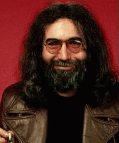 A Man With Long Hair And A Beard Wearing Glasses And A Brown Leather Jacket GIF