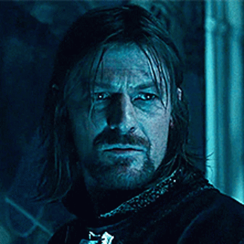 A Man With Long Hair And A Beard With The Words Blue Is Coming On His Face GIF