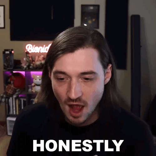 A Man With Long Hair And A Mustache Is Making A Funny Face And Says Honestly GIF