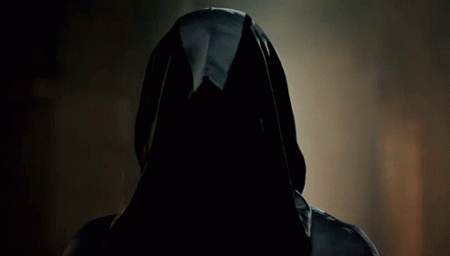 A Man With Long Hair And A Mustache Is Wearing A Cape GIF
