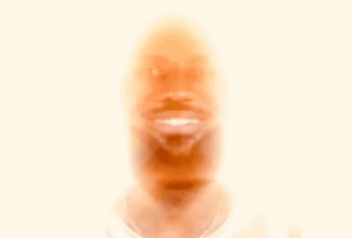 A Man With Long Hair And A Nfl Logo On His Neck GIF