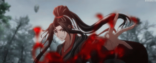 A Man With Long Hair And A Ponytail Is Surrounded By Red Blood GIF