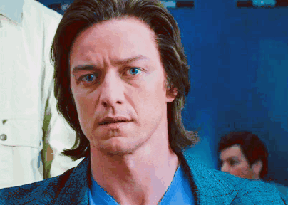 A Man With Long Hair And Blue Eyes Is Wearing A Blue Jacket And Blue Shirt GIF