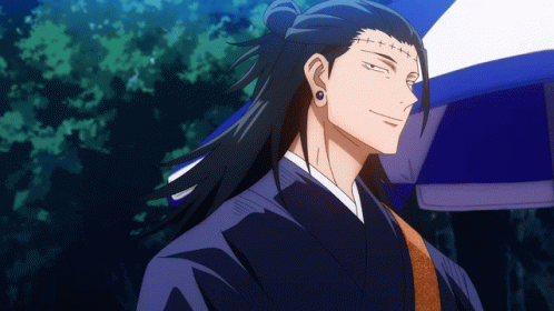 A Man With Long Hair And Earrings Is Smiling In Front Of A Blue Umbrella GIF