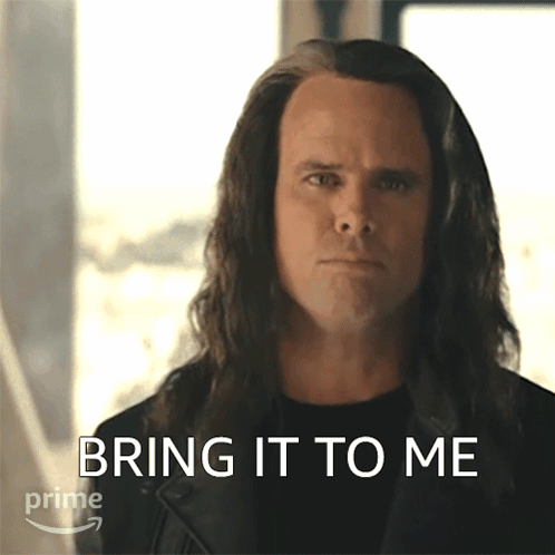 A Man With Long Hair Has The Words Bring It To Me Written On His Face GIF