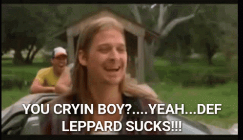 A Man With Long Hair Is Sitting In A Car And Says You Cryin Boy Yeah Def Leppard Sucks ! GIF