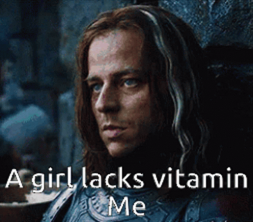 A Man With Long Hair Is Sitting In A Chair With A Caption That Says A Girl Lacks Vitamin Me . GIF