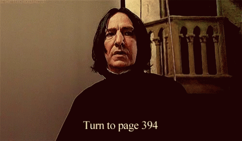 A Man With Long Hair Is Standing In Front Of A Wall And Says Turn To Page 394 GIF