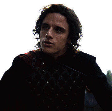 A Man With Long Hair Is Wearing A Black Jacket With Studs GIF