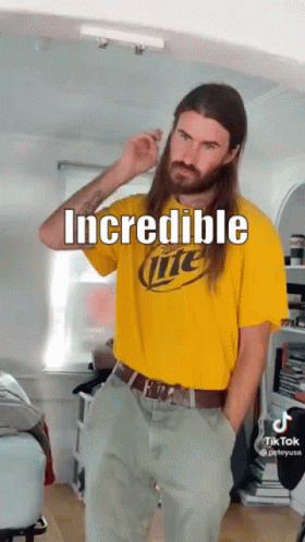 A Man With Long Hair Is Wearing A Miller Lite T-Shirt GIF