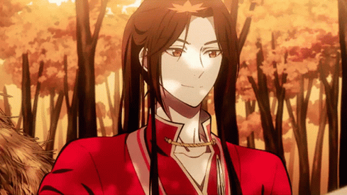 A Man With Long Hair Is Wearing A Red Shirt GIF