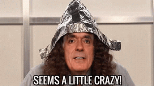 A Man With Long Hair Is Wearing A Tin Foil Hat And Says `` Seems A Little Crazy '' . GIF
