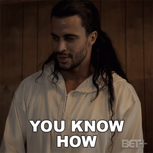 A Man With Long Hair Is Wearing A White Jacket That Says You Know How GIF