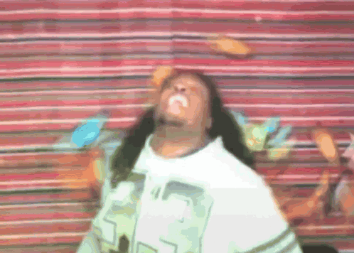 A Man With Long Hair Is Wearing A White Shirt With The Number 23 On The Front GIF