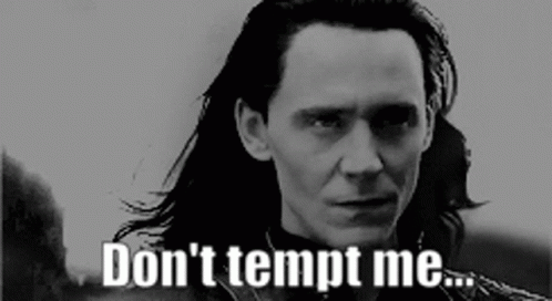 A Man With Long Hair Says " Don 'T Tempt Me " In A Black And White Photo GIF