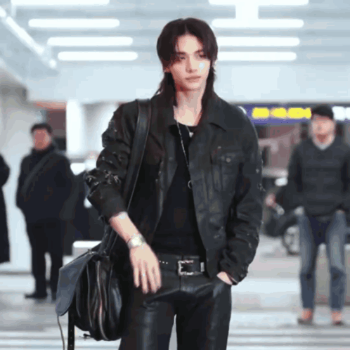 A Man With Long Hair Wearing A Leather Jacket GIF