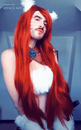 A Man With Long Red Hair And A Mustache Is Wearing A Cat Costume Made With Reface App GIF